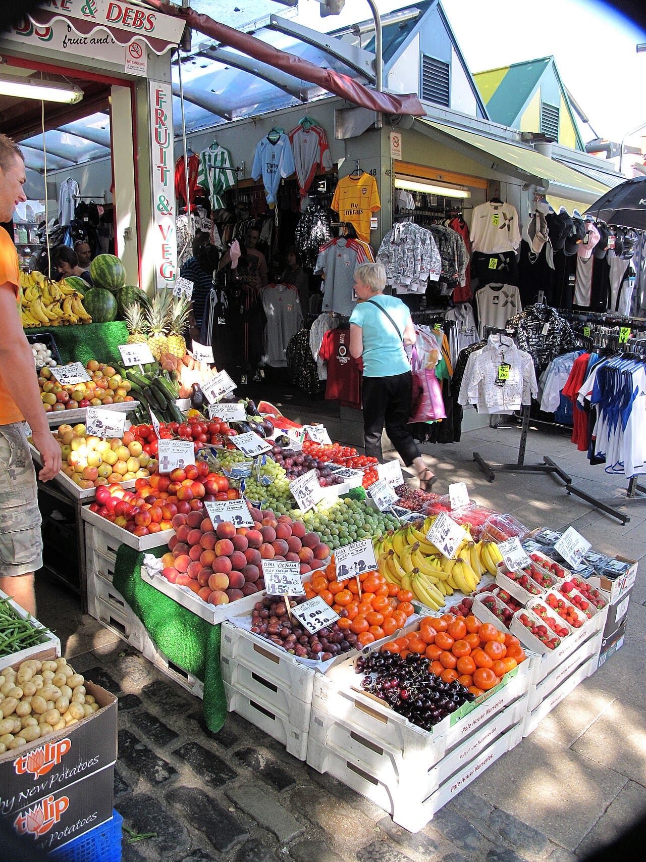 A greengrocer’s stall of fruit and vegetables on Norwich Market